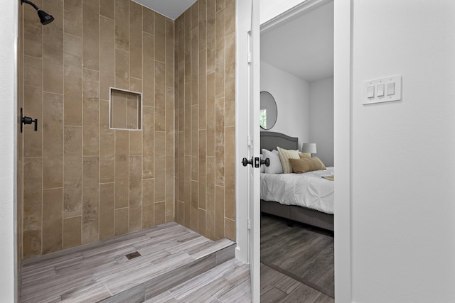 14815 Goliad Dr, Log Cabin, TX 75148 - bathroom with ensuite bath, tiled shower, and wood finished floors