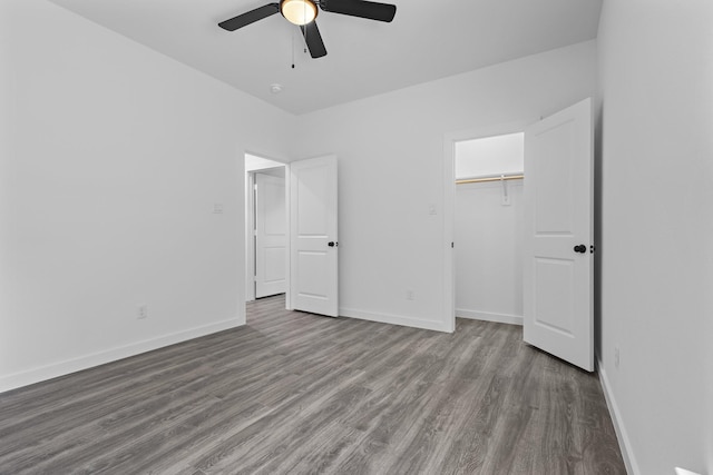 14815 Goliad Dr, Log Cabin, TX 75148 - unfurnished bedroom with wood finished floors, baseboards, a closet, and a ceiling fan