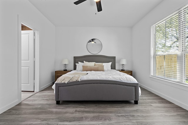 14815 Goliad Dr, Log Cabin, TX 75148 - bedroom featuring baseboards, ceiling fan, and wood finished floors