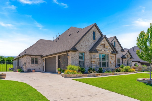 2121 Glenbrook St, Haslet, TX 76052 - french country style house featuring brick siding, driveway, a garage, and a shingled roof