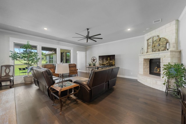 2121 Glenbrook St, Haslet, TX 76052 - living area with dark wood-style flooring, crown molding, a fireplace, a ceiling fan, and baseboards