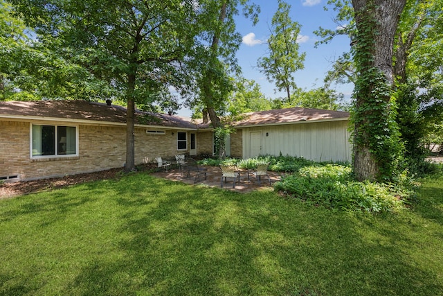 8473 Stults Rd, Dallas, TX 75243 - back of property featuring a patio area, a yard, and brick siding