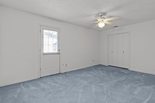 7725 Westwind Dr, Fort Worth, TX 76179 - unfurnished bedroom with carpet floors, a textured ceiling, and ceiling fan
