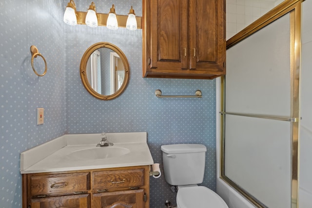 7725 Westwind Dr, Fort Worth, TX 76179 - full bathroom with toilet, vanity, wallpapered walls, and combined bath / shower with glass door