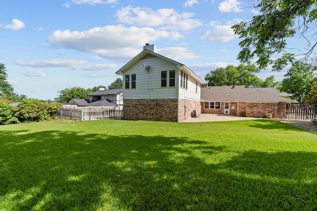 7725 Westwind Dr, Fort Worth, TX 76179 - back of house with brick siding, a patio area, and a chimney