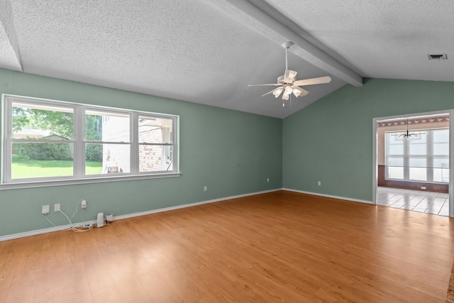 7725 Westwind Dr, Fort Worth, TX 76179 - unfurnished room featuring a textured ceiling, wood finished floors, healthy amount of natural light, ceiling fan, and baseboards