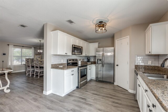 2308 Pheasant Run, Melissa, TX 75454 - kitchen featuring stainless steel appliances, a sink, tasteful backsplash, and baseboards