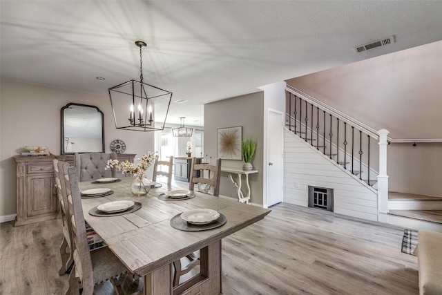 2308 Pheasant Run, Melissa, TX 75454 - dining area with light wood-style floors, stairway, a chandelier, and baseboards