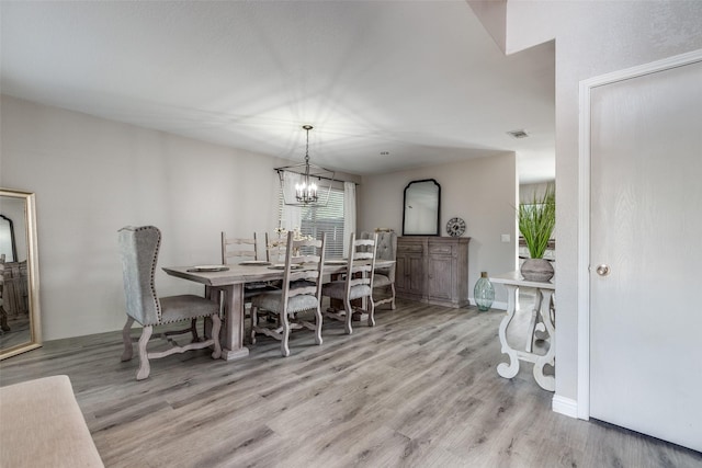 2308 Pheasant Run, Melissa, TX 75454 - dining room with a chandelier, wood finished floors, and baseboards