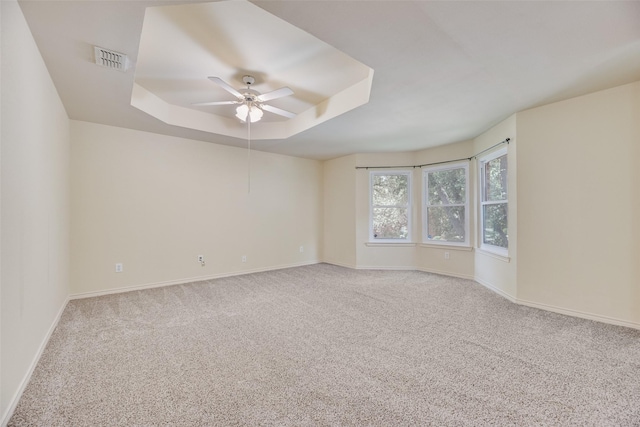 3208 Greenglen Dr, Carrollton, TX 75007 - carpeted empty room featuring a raised ceiling, ceiling fan, and baseboards