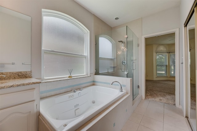 3208 Greenglen Dr, Carrollton, TX 75007 - full bath featuring a stall shower, a jetted tub, tile patterned floors, and vanity
