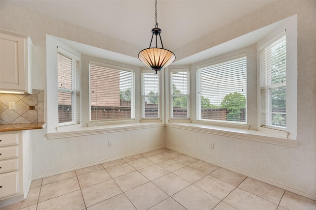 3208 Greenglen Dr, Carrollton, TX 75007 - unfurnished dining area with baseboards, healthy amount of natural light, and light tile patterned flooring