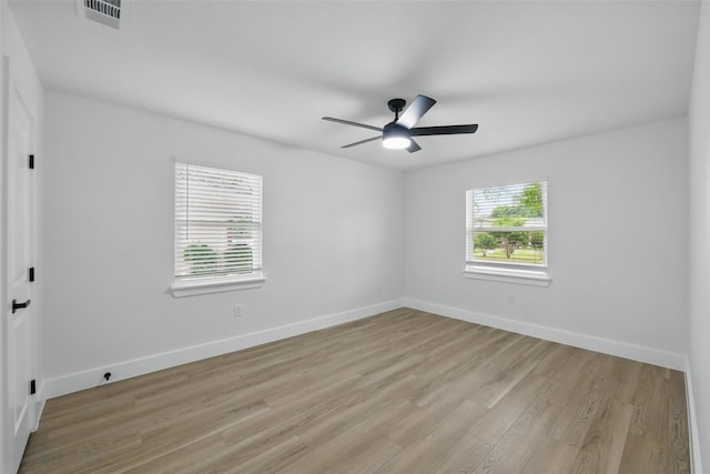 3173 Catamore Ln, Dallas, TX 75229 - unfurnished room with light wood-style floors, baseboards, and a ceiling fan