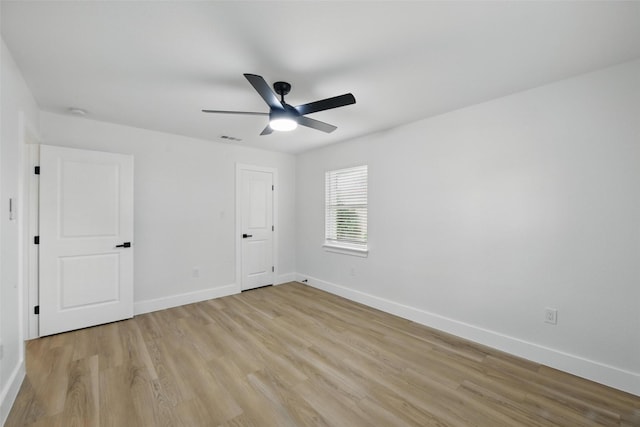 3173 Catamore Ln, Dallas, TX 75229 - unfurnished bedroom featuring light wood finished floors and baseboards