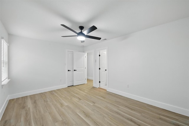 3173 Catamore Ln, Dallas, TX 75229 - unfurnished bedroom with light wood-style flooring, baseboards, and a ceiling fan