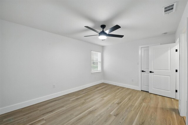 3173 Catamore Ln, Dallas, TX 75229 - unfurnished bedroom with light wood finished floors, baseboards, and a ceiling fan