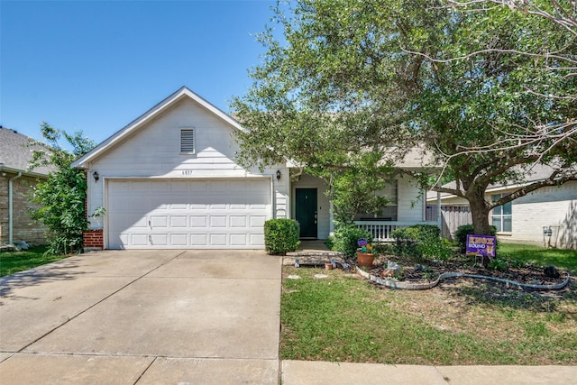6837 Beverly Glen Dr, Fort Worth, TX 76132 - view of front of property with covered porch, driveway, a garage, and a front lawn