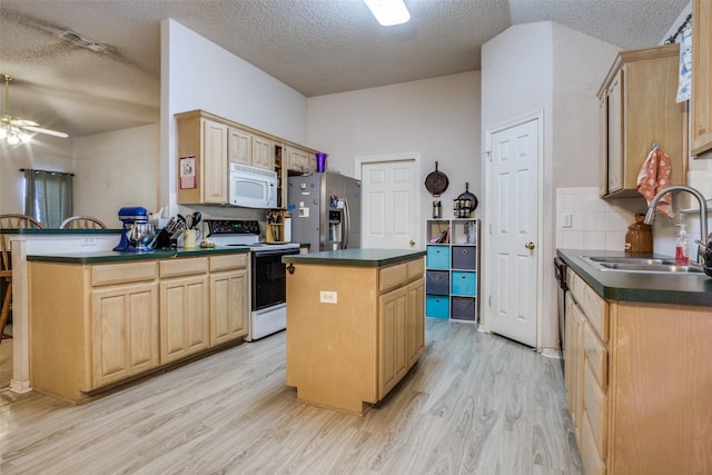 6837 Beverly Glen Dr, Fort Worth, TX 76132 - kitchen featuring range with electric cooktop, stainless steel refrigerator with ice dispenser, white microwave, a sink, and dark countertops