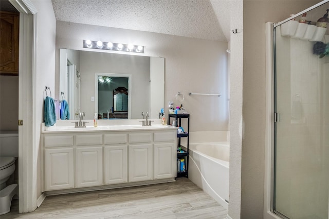 6837 Beverly Glen Dr, Fort Worth, TX 76132 - full bath with toilet, a bath, a stall shower, double vanity, and wood finished floors