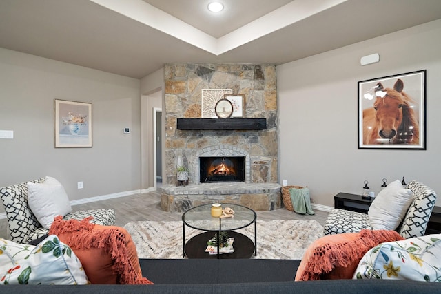 123 Cedar Elm Ln, Nevada, TX 75173 - living area featuring baseboards, a stone fireplace, and wood finished floors
