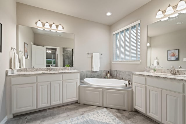 123 Cedar Elm Ln, Nevada, TX 75173 - full bathroom with two vanities, a bath, and a shower with door