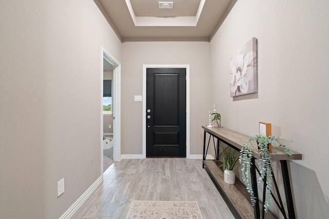 123 Cedar Elm Ln, Nevada, TX 75173 - foyer entrance with wood finished floors, a raised ceiling, and baseboards