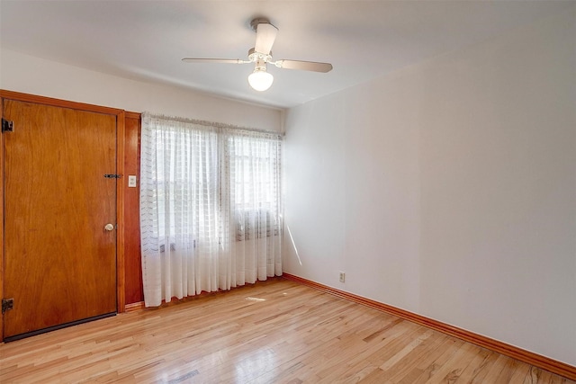1245 Hodgson St, Fort Worth, TX 76115 - empty room featuring light wood-style flooring, baseboards, and a ceiling fan