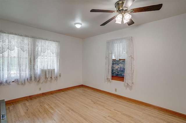 1245 Hodgson St, Fort Worth, TX 76115 - unfurnished room with plenty of natural light, light wood finished floors, ceiling fan, and baseboards