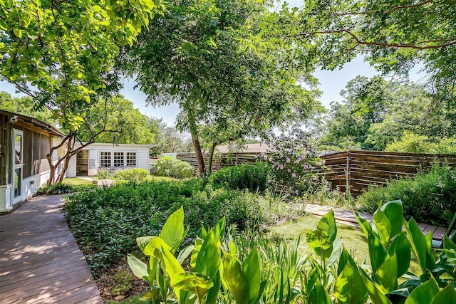 1245 Hodgson St, Fort Worth, TX 76115 - fenced backyard with an outbuilding
