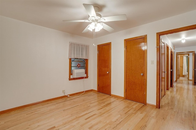 1245 Hodgson St, Fort Worth, TX 76115 - unfurnished bedroom featuring light wood finished floors, baseboards, a ceiling fan, and cooling unit