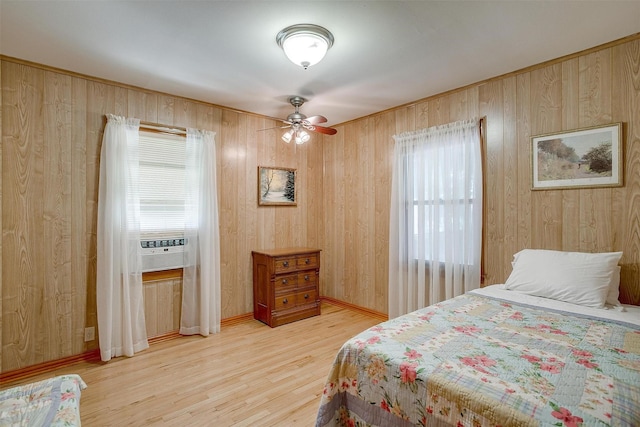 1245 Hodgson St, Fort Worth, TX 76115 - bedroom with wood finished floors, wooden walls, and baseboards