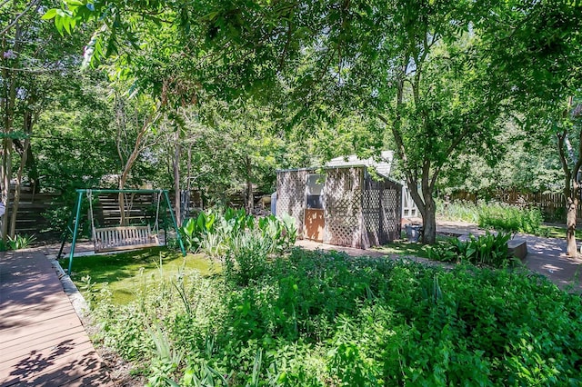 1245 Hodgson St, Fort Worth, TX 76115 - fenced yard with a wooden deck