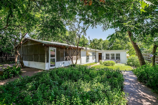 1245 Hodgson St, Fort Worth, TX 76115 - view of front of house with a sunroom