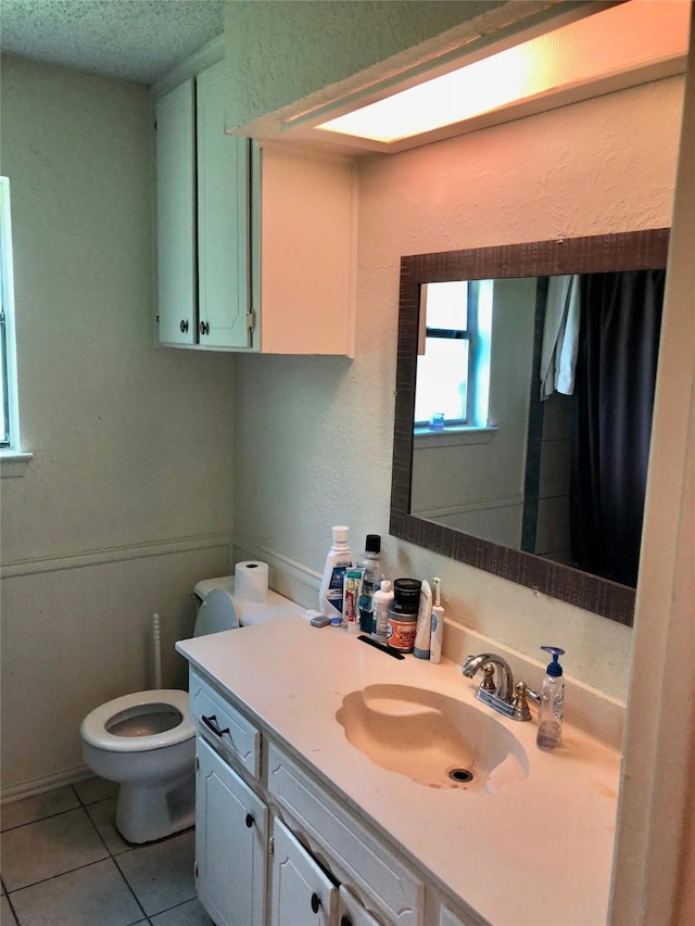 3107 Green Valley Ln, Arlington, TX 76014 - full bathroom with vanity, tile patterned flooring, and a textured ceiling
