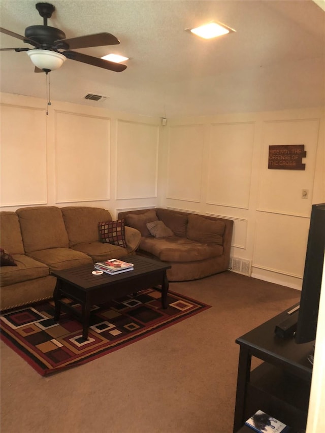 3107 Green Valley Ln, Arlington, TX 76014 - living area featuring a decorative wall, a ceiling fan, and carpet