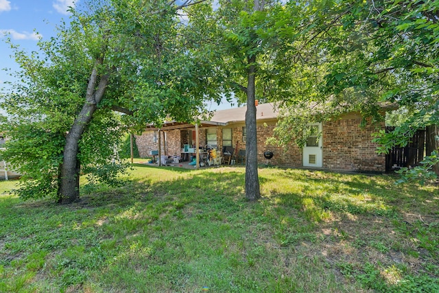 3107 Green Valley Ln, Arlington, TX 76014 - view of grassy yard with a patio