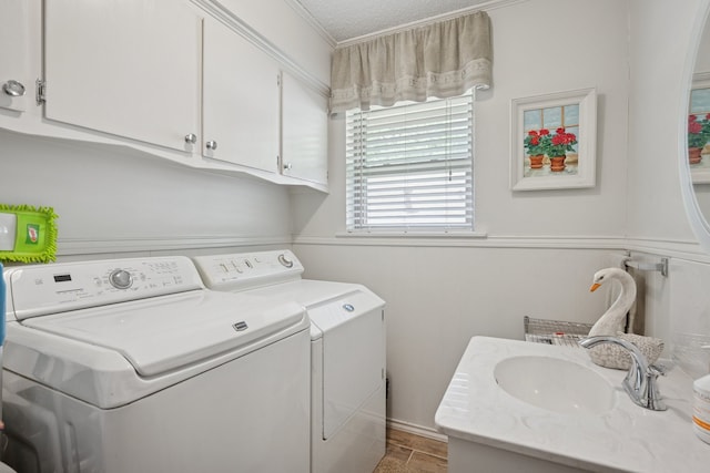 10930 Ridgemeadow Dr, Dallas, TX 75218 - washroom with independent washer and dryer, cabinet space, and crown molding