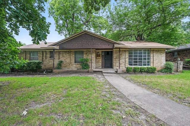 6330 Autumn Woods Trl, Dallas, TX 75232 - ranch-style house with a front lawn and brick siding