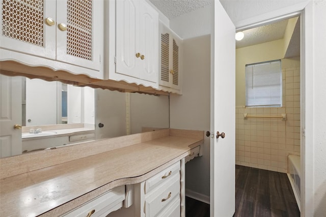 6330 Autumn Woods Trl, Dallas, TX 75232 - full bathroom with vanity, wood finished floors, and a textured ceiling
