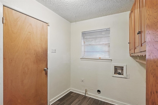 6330 Autumn Woods Trl, Dallas, TX 75232 - washroom with cabinet space, dark wood-type flooring, electric dryer hookup, hookup for a washing machine, and a textured ceiling