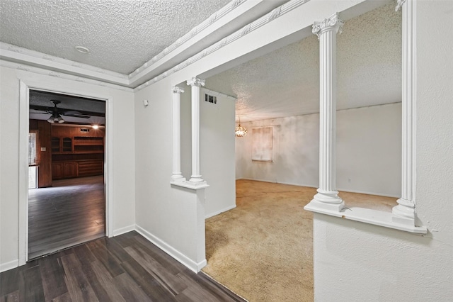 6330 Autumn Woods Trl, Dallas, TX 75232 - hall featuring decorative columns, a textured ceiling, wood finished floors, and baseboards