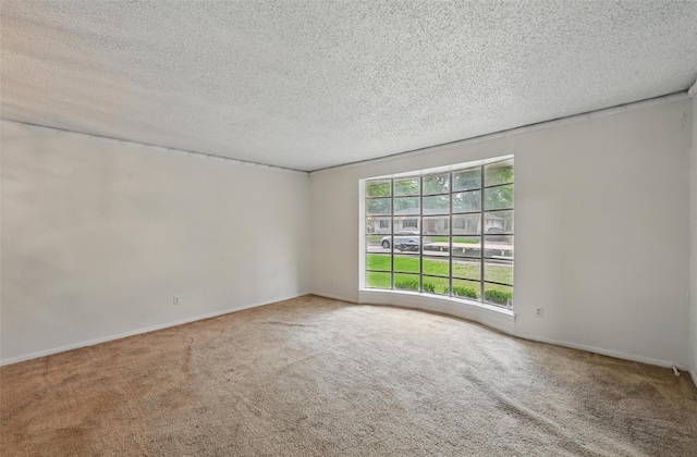6330 Autumn Woods Trl, Dallas, TX 75232 - carpeted spare room with a textured ceiling and baseboards
