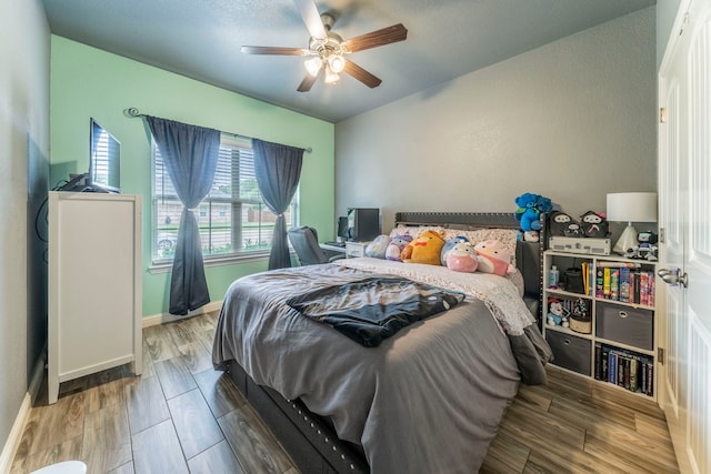 313 Donna Cir, Granbury, TX 76049 - bedroom with wood finished floors, baseboards, and a ceiling fan