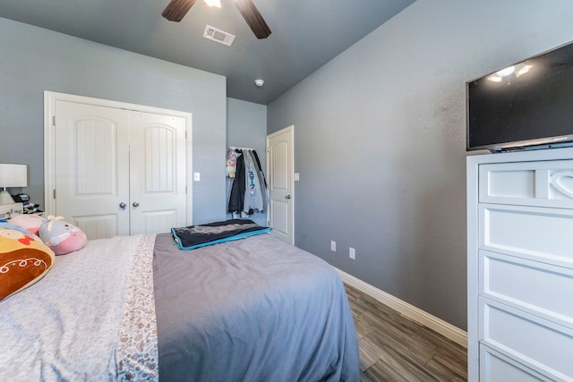 313 Donna Cir, Granbury, TX 76049 - bedroom featuring dark wood-style flooring, baseboards, a closet, and a ceiling fan