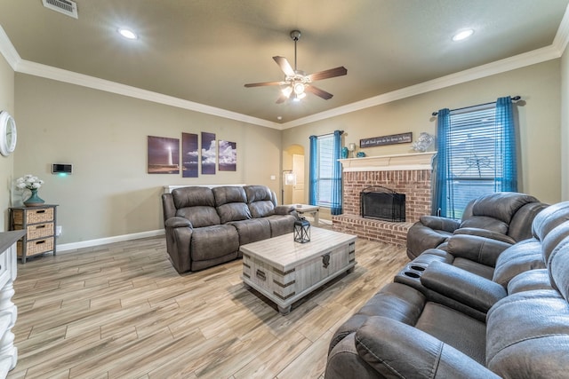313 Donna Cir, Granbury, TX 76049 - living area with ceiling fan, light wood-style flooring, baseboards, ornamental molding, and a fireplace