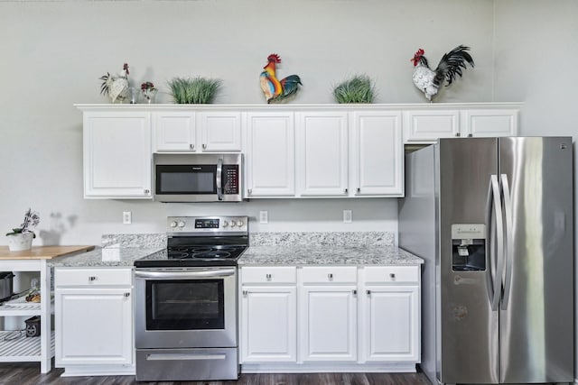 5789 Southfork Dr N, Royse City, TX 75189 - kitchen with appliances with stainless steel finishes, white cabinetry, and dark wood-style floors