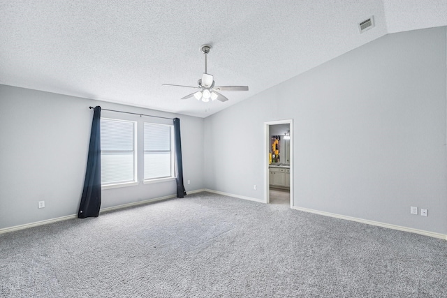 5789 Southfork Dr N, Royse City, TX 75189 - spare room featuring vaulted ceiling, a ceiling fan, carpet floors, and a textured ceiling