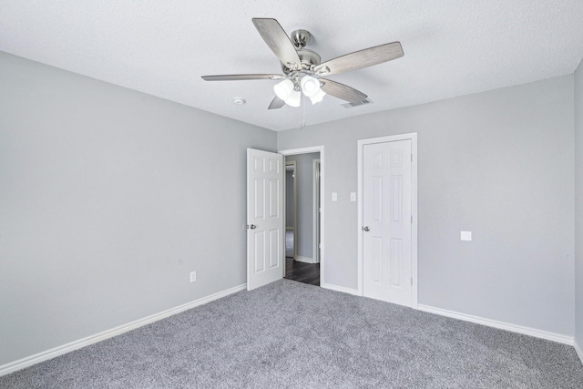 5789 Southfork Dr N, Royse City, TX 75189 - unfurnished bedroom featuring carpet, a ceiling fan, and a textured ceiling