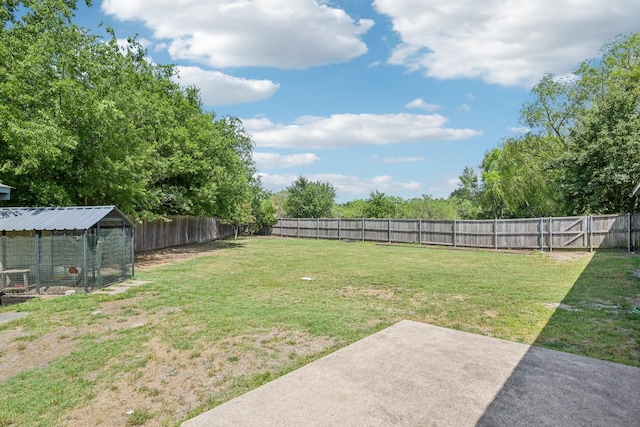 5789 Southfork Dr N, Royse City, TX 75189 - fenced backyard featuring exterior structure, a patio area, and an outbuilding