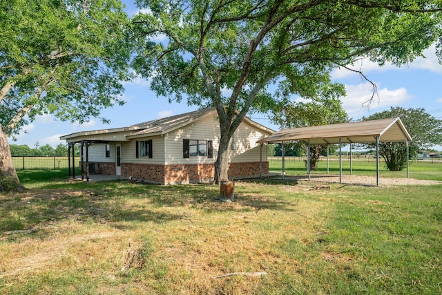 190 Rs County Road 4330, Point, TX 75472 - view of side of home with brick siding and a carport